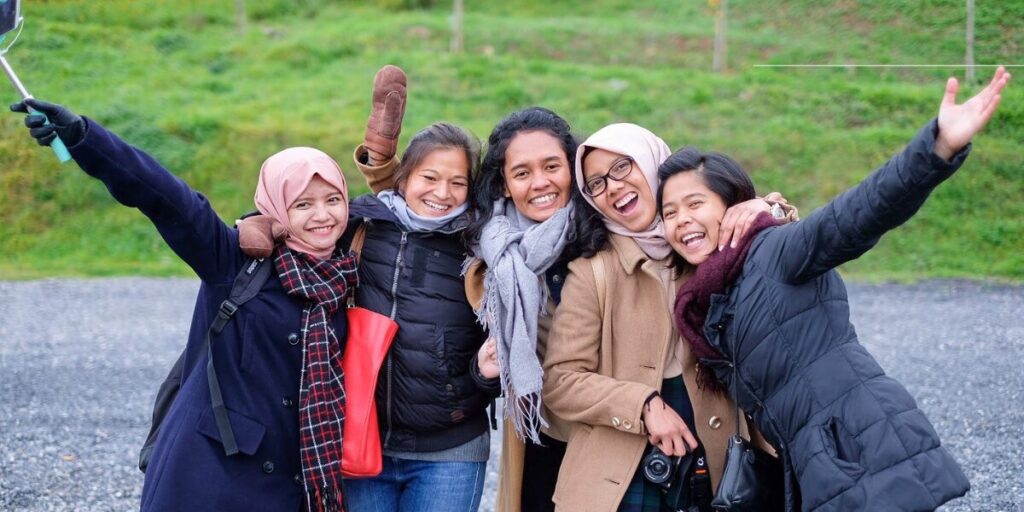 A group of woman who send international money transfer.